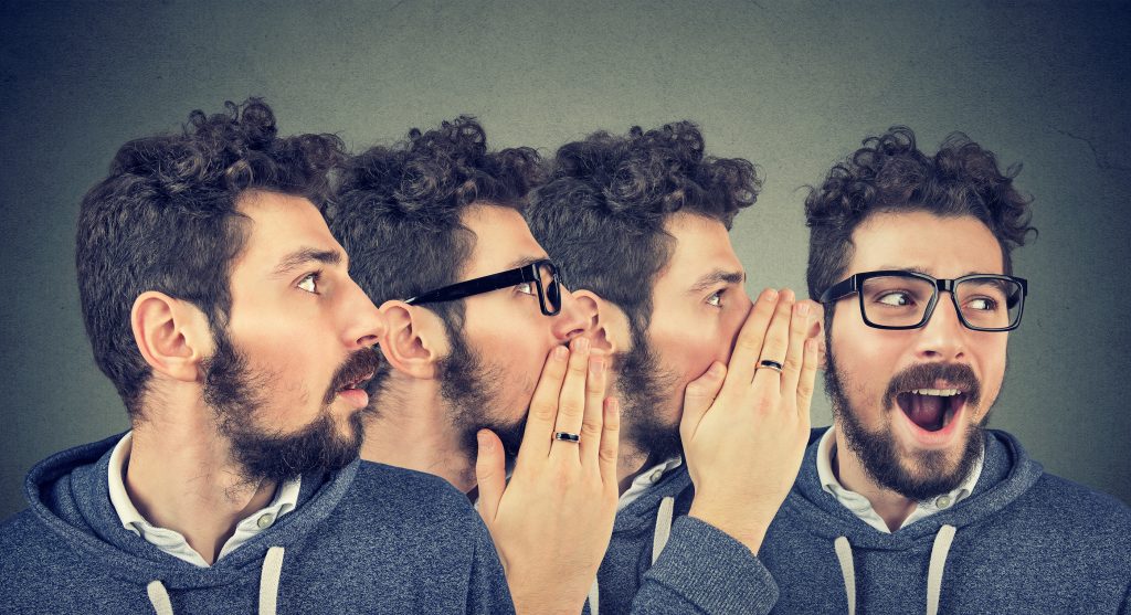 Four people sharing word of mouth